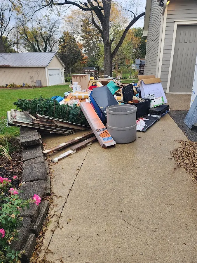 Dumpster being loaded with debris for Residential Dumpster Rental in Stanwood